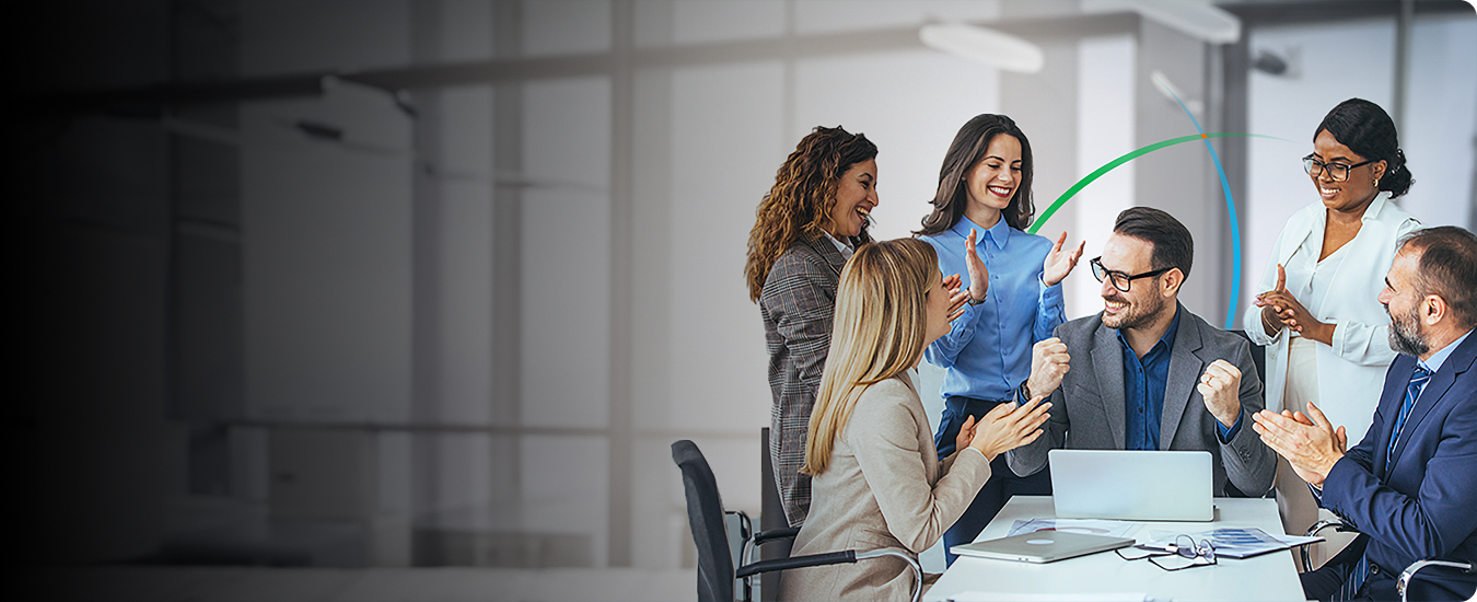 banner showing a team of business professionals celebrating success in a modern office space