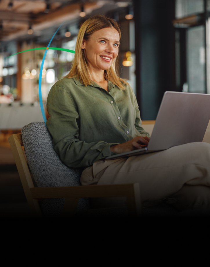 banner showing a smiling business professional working on her laptop