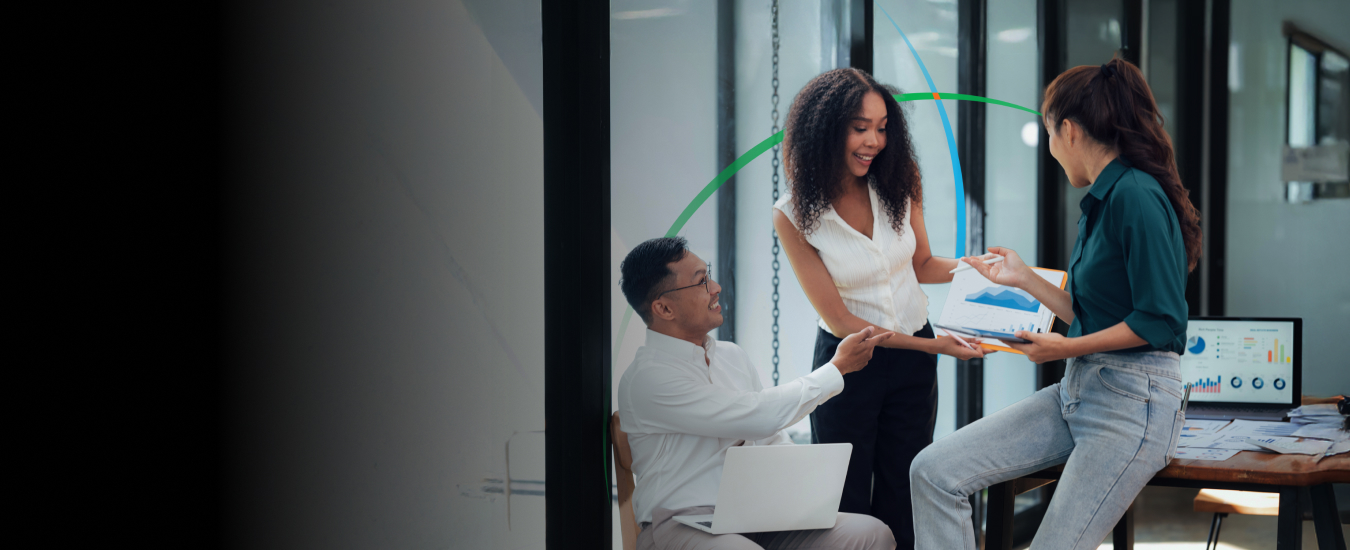 banner showing a team of business professionals looking at data-driven insights on a mobile device