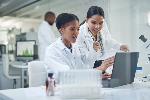 stock-photo-improving-lives-one-collaboration-at-a-time-shot-of-two-young-scientists-using-a-laptop-in-a-2137211293 1